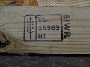 After we construct a crate using compliant lumber, we put our own "wheat stamp" on it. 
